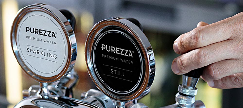 Purezza sparkling water tap being used in a restaurant